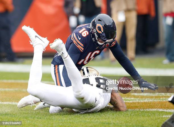 Gray of the New Orleans Saints blocks a punt by Pat O'Donnell of the Chicago Bears and it is a safety during the first quarter at Soldier Field on...