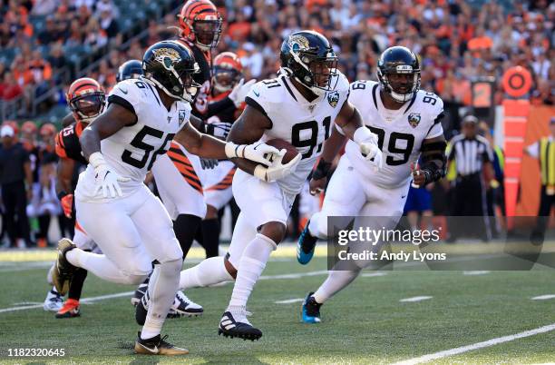 Yannick Ngakoue of the Jacksonville Jaguars returns an interception for a touchdown against the Cincinnati Bengals at Paul Brown Stadium on October...