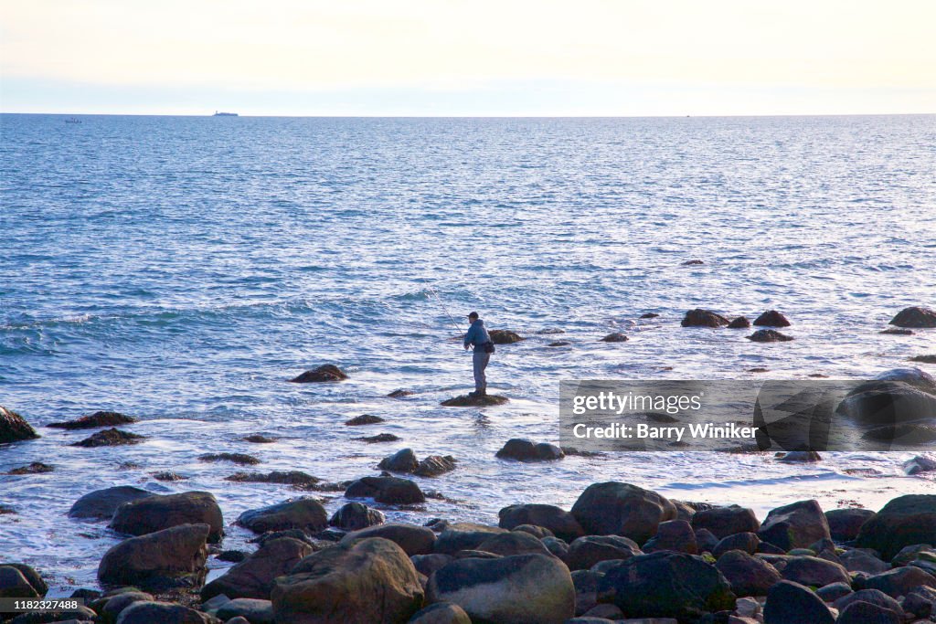 Man fishing at Misquamicut, Westerly
