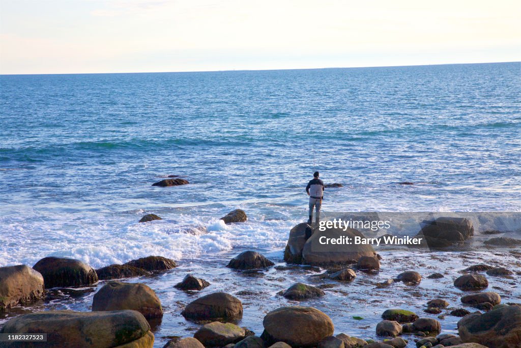 Man fishing at Misquamicut, Westerly