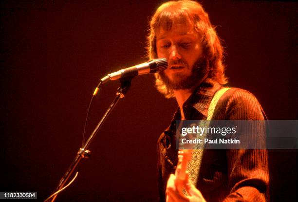 American Rock and Pop musician Tom Kelly, of the group Toto, plays guitar as he performs onstage at the Park West, Chicago, Illinois, August 2, 1985.