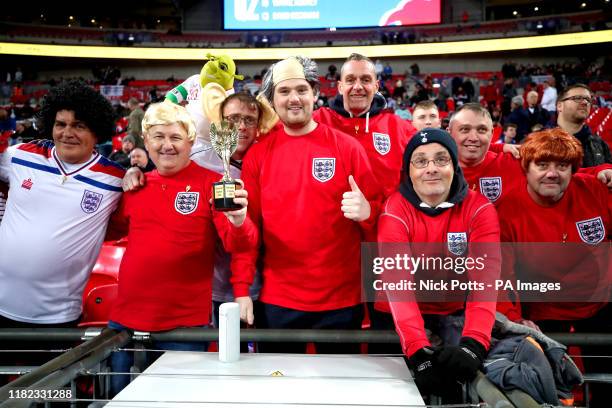 England fans in the stands dressed as former England players such as Alan Ball, Bobby Charlton, Bobby Moore and Kevin Keegan prior to the beginning...