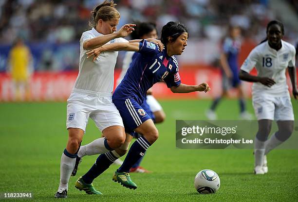 Yuki Nagasato of Japan forces her way past Rachel Unitt of England during the FIFA Womens World Cup Group B match between England and Japan in...