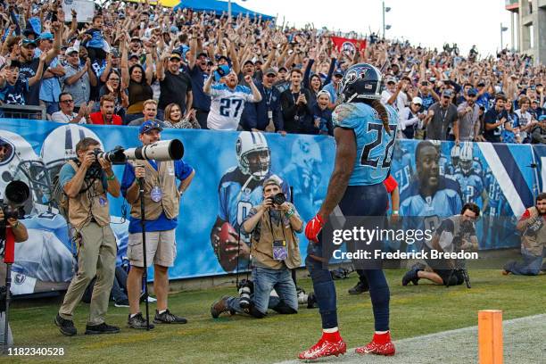 Fans cheer after Derrick Henry of the Tennessee Titans scores a touchdown against the Los Angeles Chargers during the second half at Nissan Stadium...