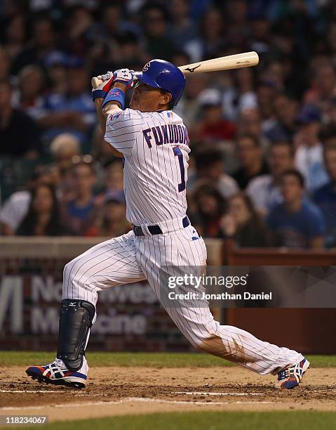 Kosuke Fukudome of the Chicago Cubs hits the ball against the San Francisco Giants at Wrigley Field on June 29, 2011 in Chicago, Illinois. The Cubs...