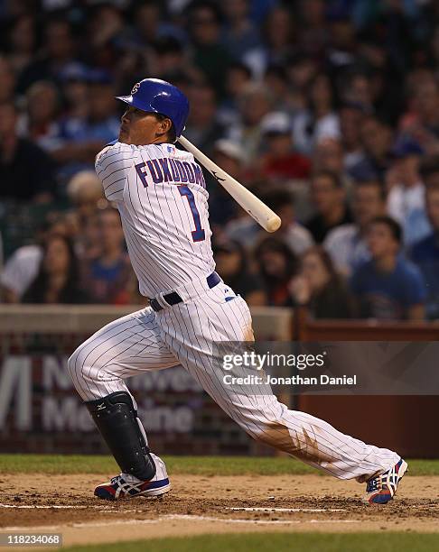 Kosuke Fukudome of the Chicago Cubs hits the ball against the San Francisco Giants at Wrigley Field on June 29, 2011 in Chicago, Illinois. The Cubs...