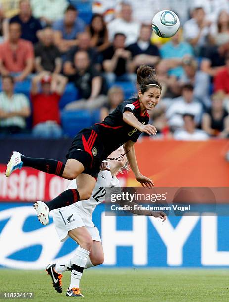 Betsy Hassett of New Zealand and Guadalupe Worbis of Mexico battle for the ball during the FIFA Women's World Cup 2011 Group B match between New...