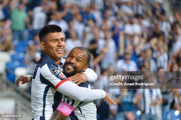 Jesús Gallardo, #17 of Monterrey, celebrates with teammate Dorlan Pabón, #8, after scoring his team's first goal during the 14th round match between...