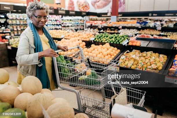 senior woman and grocery shopping - seniors shopping stock pictures, royalty-free photos & images