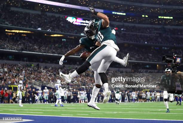 Dallas Goedert of the Philadelphia Eagles celebrates scoring a touchdown during the first quarter against the Dallas Cowboys in the game at AT&T...