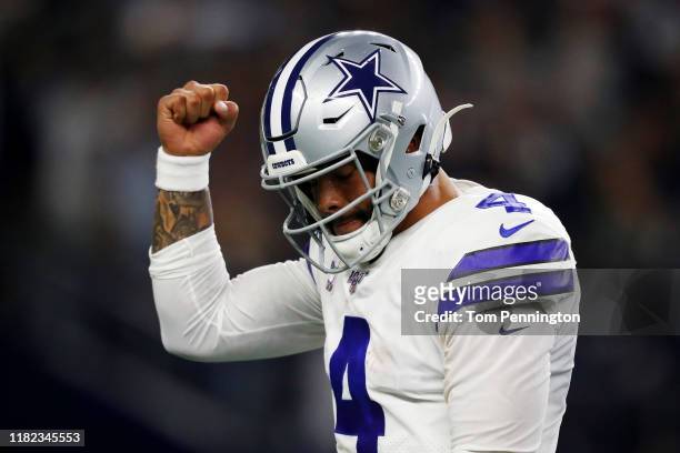 Dak Prescott of the Dallas Cowboys celebrates a first quarter touchdown against the Philadelphia Eagles in the game at AT&T Stadium on October 20,...