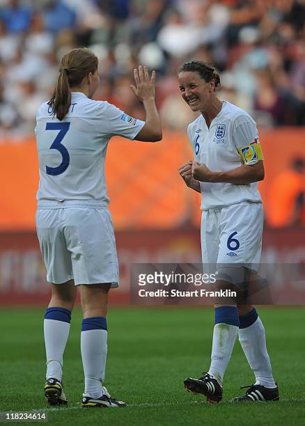 Rachel Unitt and captain Casey Stoney of England celebrate at the end of the FIFA Women's World Cup 2011 group B match between England and Japan at...