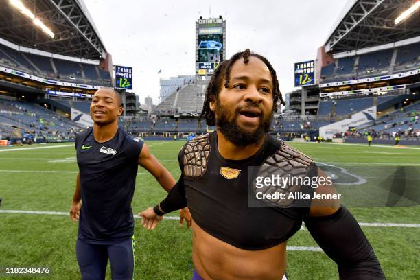 Earl Thomas of the Baltimore Ravens and Tyler Lockett of the Seattle Seahawks exchange pleasantries after the game at CenturyLink Field on October...