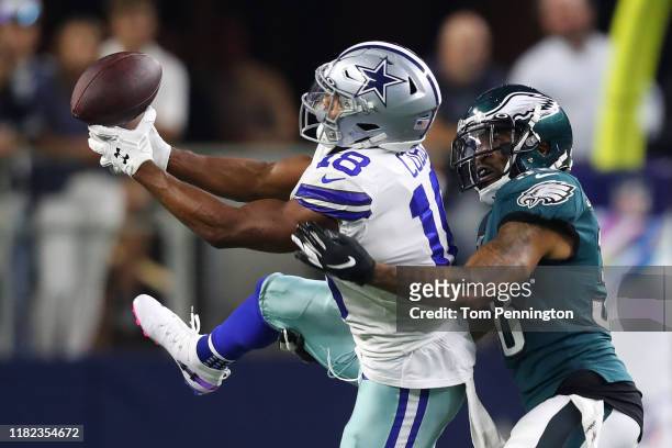 Randall Cobb of the Dallas Cowboys attempts to make a catch against Orlando Scandrick of the Philadelphia Eagles during the first half in the game at...