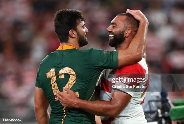Michael Leitch of Japan embraces Damian De Allende of South Africa after the Rugby World Cup 2019 Quarter Final match between Japan and South Africa...