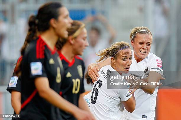 Rebecca Smith and Hannah Wilkinson of New Zealand react after Smith scored a goal against Mexico during the FIFA Women's World Cup 2011 Group B match...