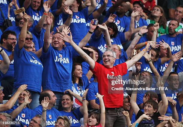 Fan of England and many fans of Japan celebrate during the FIFA Women's World Cup 2011 group B match between England and Japan at FIFA World Cup...