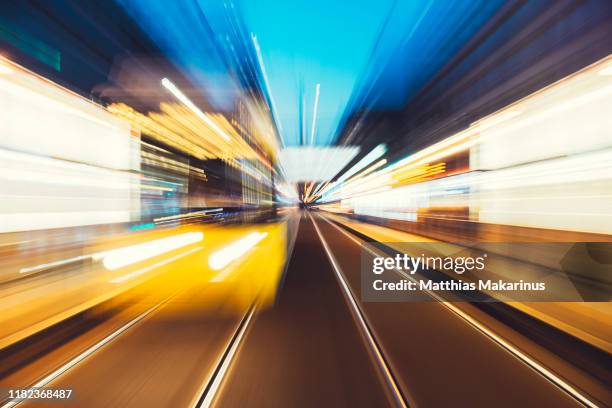 modern creative zoom rush hour night street scene with train in motion in berlin - long exposure train stock pictures, royalty-free photos & images