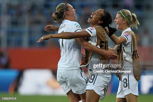 Hannah Wilkinson celebrates the second goal Kristy Hill and Katie Bowen during the FIFA Women's World Cup 2011 Group B match between New Zealand and...