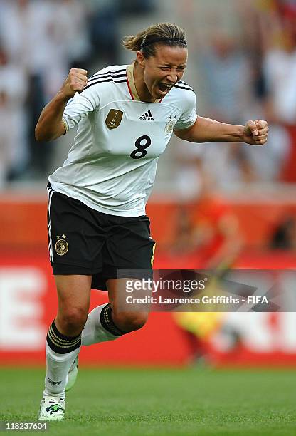Inka Grings of Germany celebrates scoring the scecond goal during the FIFA Women's World Cup 2011 Group A match between France and Germany at...