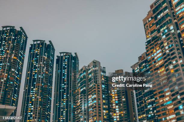 densely populated hong kong high rise residential buildings. - hong kong residential building stock pictures, royalty-free photos & images