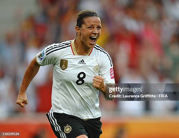 Inka Grings of Germany celebrates scoring the scecond goal during the FIFA Women's World Cup 2011 Group A match between France and Germany at...