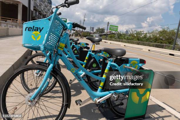 relay rental bike parking station in atlanta - relay ventures stock pictures, royalty-free photos & images
