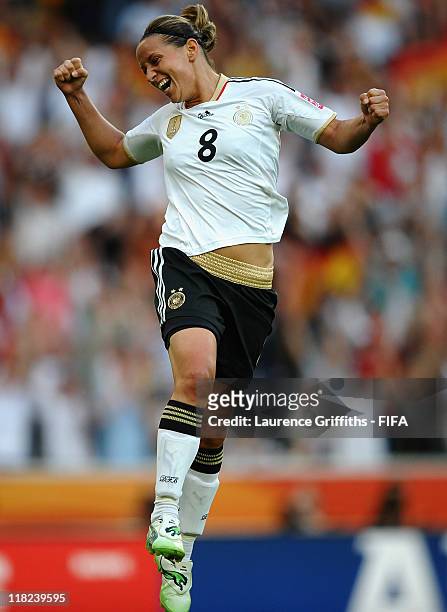 Inka Grings of Germany celebrates scoring the scecond goal during the FIFA Women's World Cup 2011 Group A match between France and Germany at...
