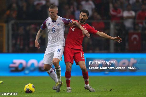 Ragnar Sigurdsson of Iceland and Mahmut Tekdemir of Turkey during the UEFA Euro 2020 qualifier between Turkey and Iceland at Ali Sami Yen Arena on...