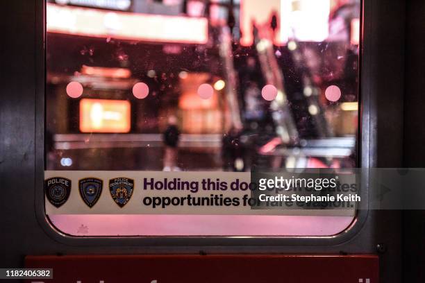 Sign against fare evasion is seen at a subway station on November 14, 2019 in New York City. The MTA, which oversees the New York City subway system,...