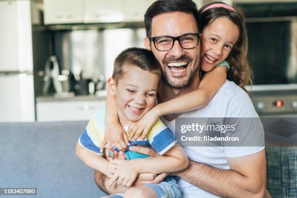 portrait of father and children - son daughter stock pictures, royalty-free photos & images