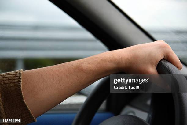 Auton Hand Driving Hand On Wheel Photos and Premium High Res Pictures - Getty Images