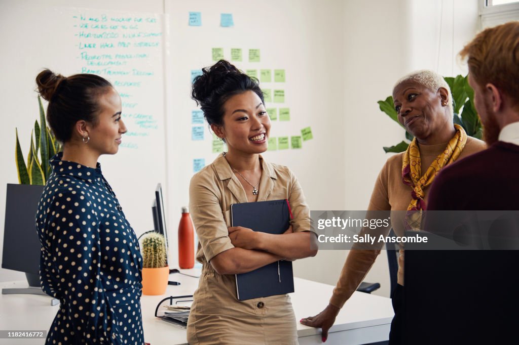 Group of people at a start up business having a project meeting