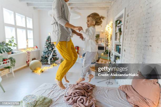 christmas in our apartment - pyjamas stock pictures, royalty-free photos & images