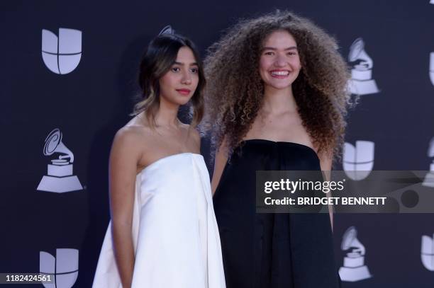 Brazilian musical duo Anavitoria members Ana Clara Caetano and Vitoria Falcao arrive at the 20th Annual Latin Grammy Awards in Las Vegas, Nevada, on...