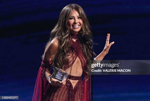 Mexican singer Thalia speaks after winning the Premio de la Presidencia Award during the 20th Annual Latin Grammy Awards in Las Vegas, Nevada, on...