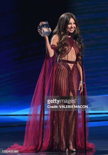 Mexican singer Thalia speaks after winning the Premio de la Presidencia Award during the 20th Annual Latin Grammy Awards in Las Vegas, Nevada, on...
