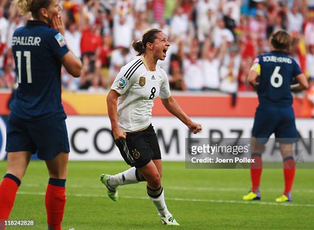Inka Grings of Germany celebrates after scoring her team's second goal during the FIFA Women's World Cup 2011 Group A match between France and...