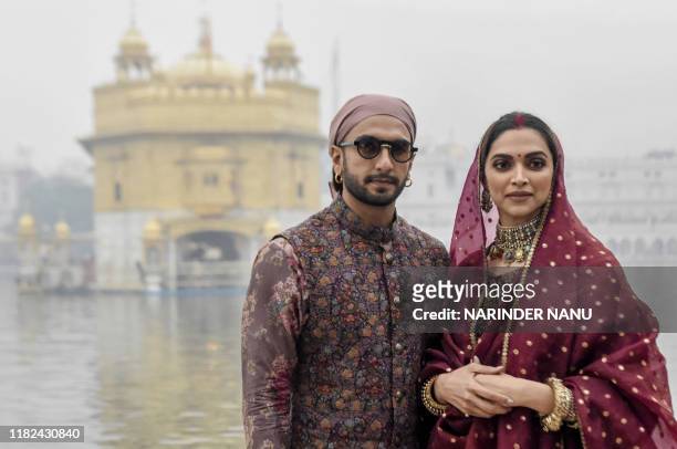 Bollywood actress Deepika Padukone along with her husband actor Ranveer Singh pay respect, to celebrate their one-year wedding anniversary, at the...