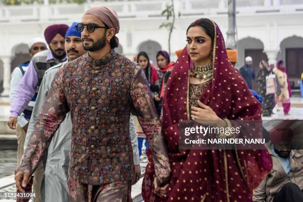 Bollywood actress Deepika Padukone along with her husband actor Ranveer Singh arrive to pay respect, celebrating their one-year wedding anniversary,...