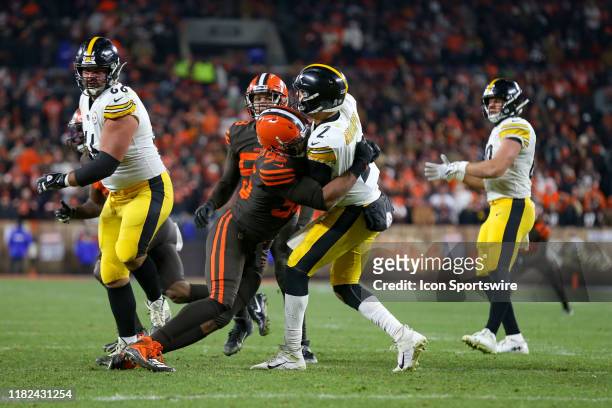 Cleveland Browns defensive end Myles Garrett hits Pittsburgh Steelers quarterback Mason Rudolph after Rudolph threw a pass during the fourth quarter...
