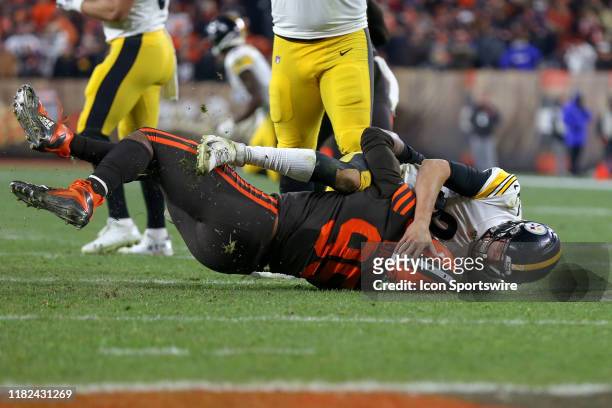 Cleveland Browns defensive end Myles Garrett takes Pittsburgh Steelers quarterback Mason Rudolph to the ground during the fourth quarter of the...