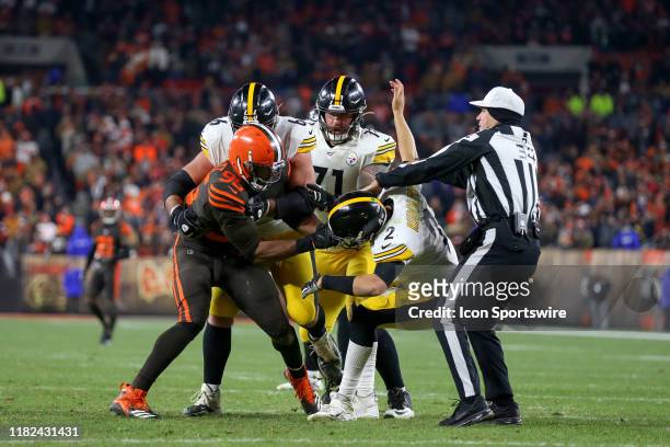 Cleveland Browns defensive end Myles Garrett attempts to remove the helmet of Pittsburgh Steelers quarterback Mason Rudolph as Pittsburgh Steelers...