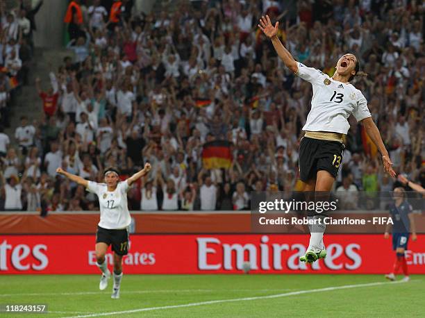 Celia Okoyino Da Mbabi of Germany celebrates her goal during the FIFA Women's World Cup 2011 Group A match between France and Germany at Borussia...