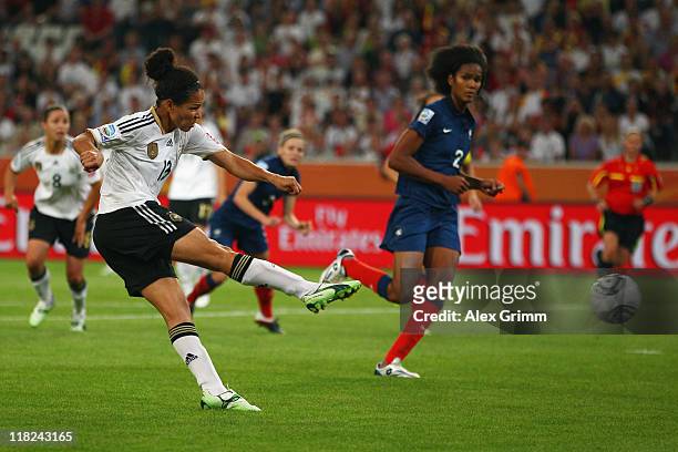 Celia Okoyino da Mbabi of Germany scores her team's fourth goal during the FIFA Women's World Cup 2011 Group A match between France and Germany at...