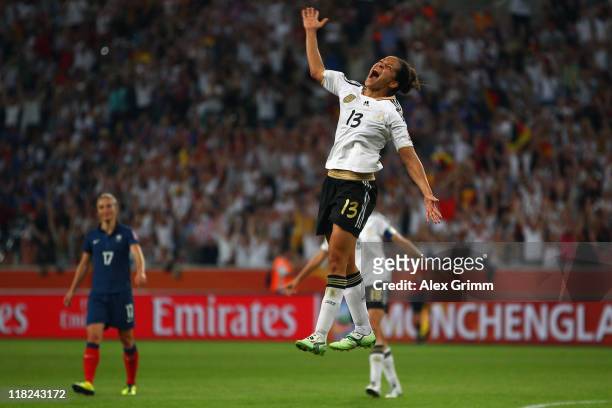 Celia Okoyino da Mbabi dd celebrates her team's fourth goal during the FIFA Women's World Cup 2011 Group A match between France and Germany at the...