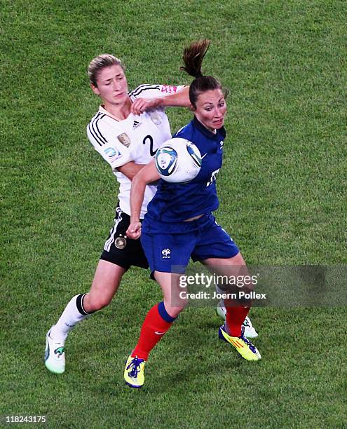Gaetane Thiney of France and Bianca Schmidt of Germany battle for the ball during the FIFA Women's World Cup 2011 Group A match between France and...