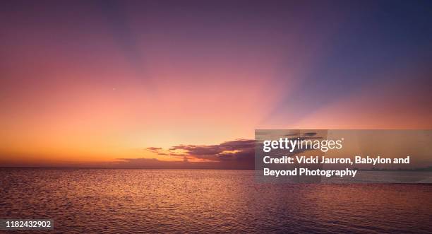 beautiful pink and orange sunset cloudscape drama at fort myers beach, florida - gulf of mexico stock pictures, royalty-free photos & images