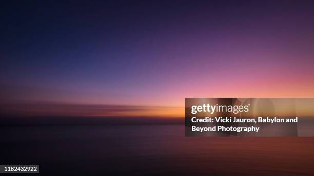 artistic vibrant colors of pink and purple at sunset at fort myers beach, florida - florida beaches 個照片及圖片檔