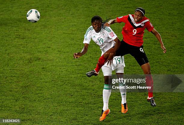 Candace Chapman of Canada in action with Uchechi Sunday of Nigeria in action during the FIFA Women's World Cup 2011 Group A match between Canada and...